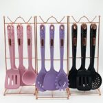 Multicolor silicone kitchen utensil set with a stainless steel stand.